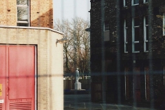 Looking_East_into_Alderson_Courtyard__Original_Building_on_Right_Electric_Substation__Red_Door__edit_sm